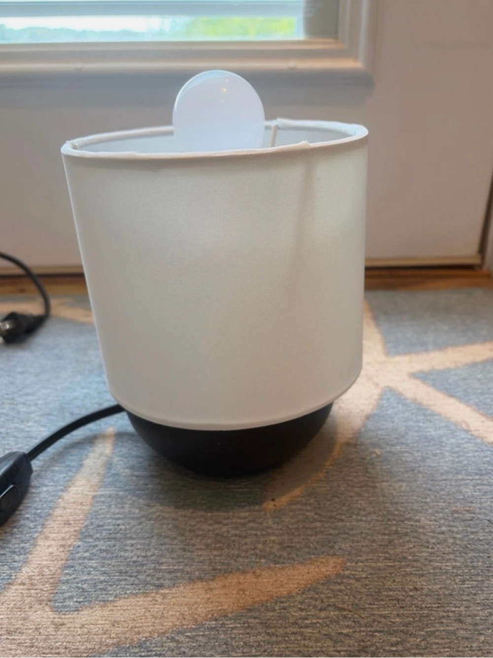Brand new ikea table lamp with black base and white shade and light bulb